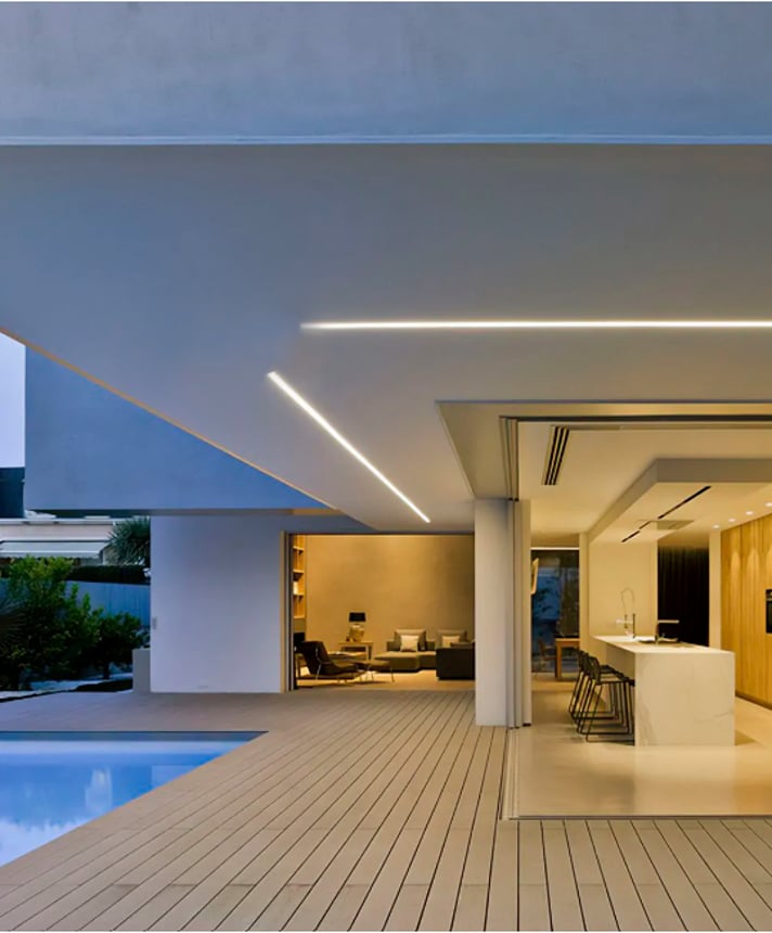 Alcon Lighting's 12100-8-R recessed linear wet location ceiling light shown in a silver finish with a flush lens.