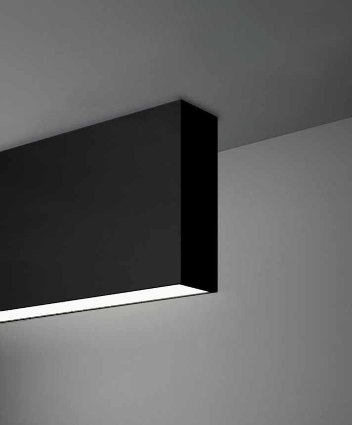 Alcon 12100-14-S, surface linear ceiling light shown in black finish and with a flush trim-less lens.