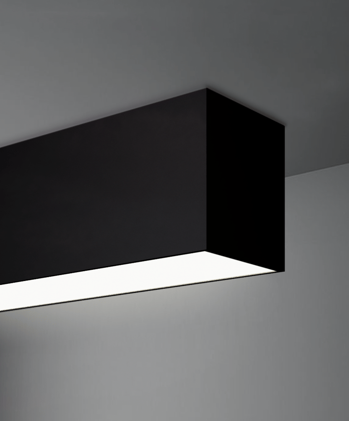 Alcon 12100-40-S, surface linear ceiling light shown in black finish and with a flush trim-less lens.