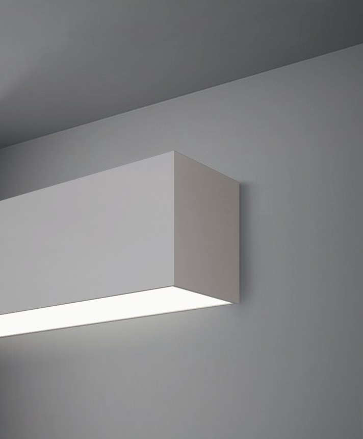 Alcon 12100-40-W, surface mount linear wall light shown in silver finish and with a flush trimless bottom lens.