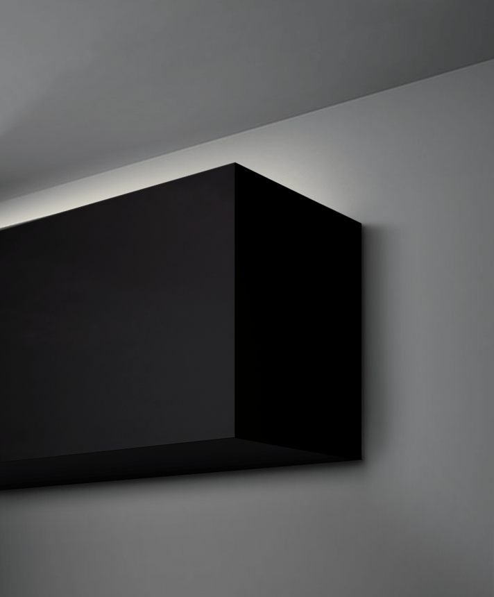 Alcon 12100-66-W-I, surface mount linear wall light shown in black finish and with a flush trim-less top lens.