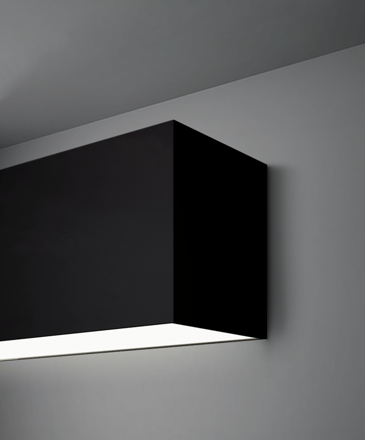 Alcon 12100-66-W, surface mount linear wall light shown in black finish and with a flush trimless bottom lens.