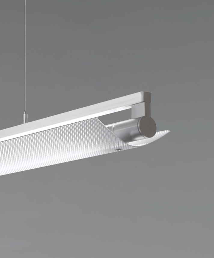 12160-P-PDI suspended linear light shown in silver finish and with a wide curved perforated direct/indirect lens