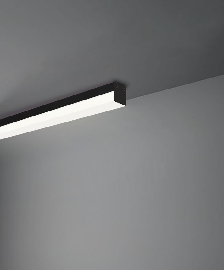 Alcon 12100-10-S, surface linear ceiling light shown in black finish and with a flush trim-less lens.