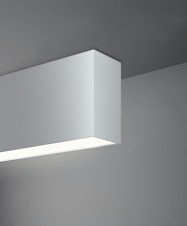 Alcon 12100-20-S, surface linear ceiling light shown in silver finish and with a flush trim-less lens.