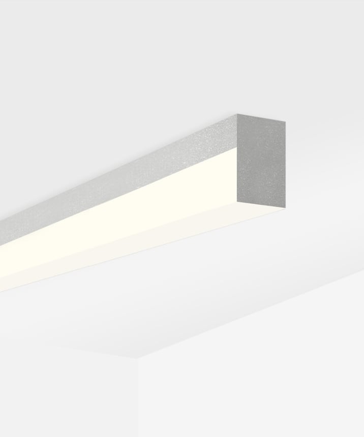Alcon 12100-8-S, surface linear ceiling light shown in silver finish and with a flush trim-less lens.