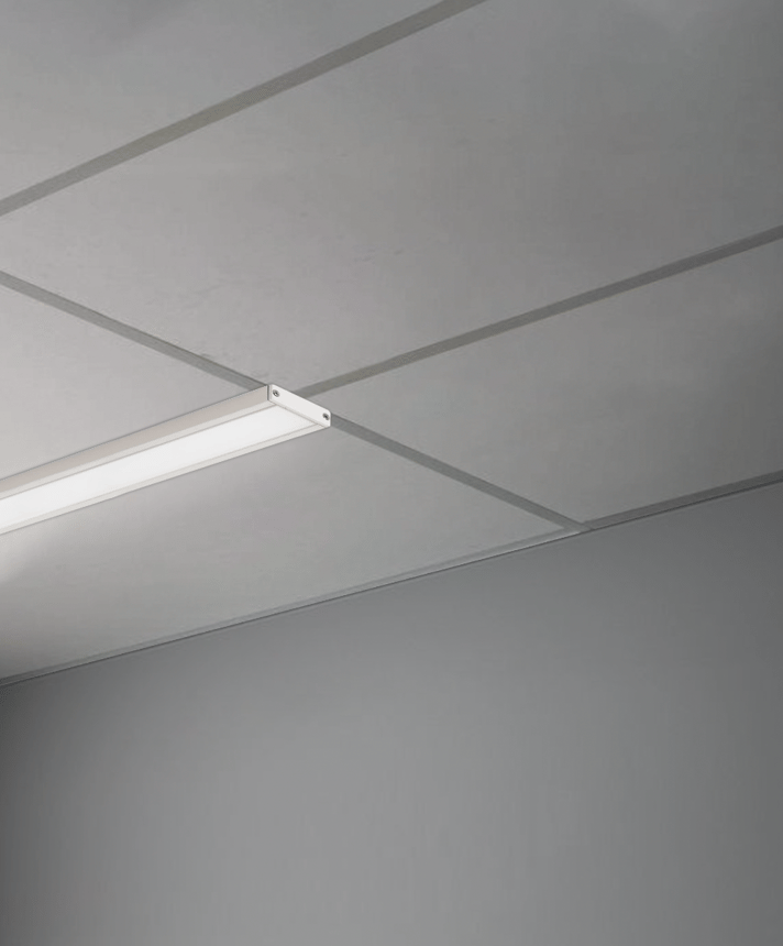 Alcon 14027-S, T-bar attaching surface linear ceiling light shown in white and with a flush lens.