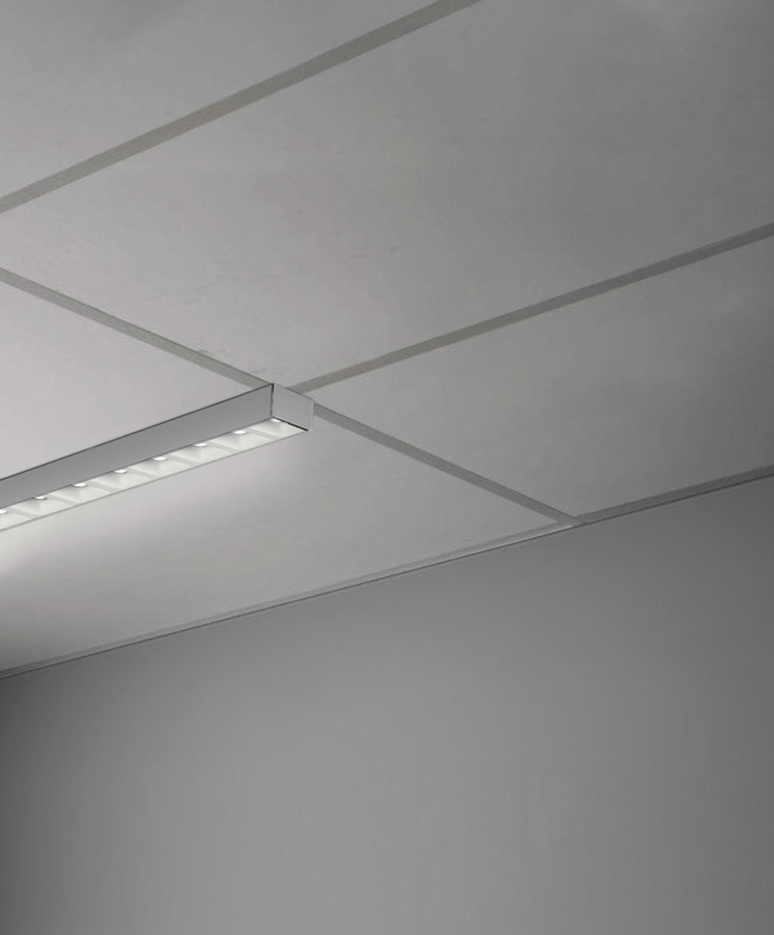 Alcon 14030-10-LVR-S, T-bar attaching surface linear ceiling light shown in silver and with a louvered lens.