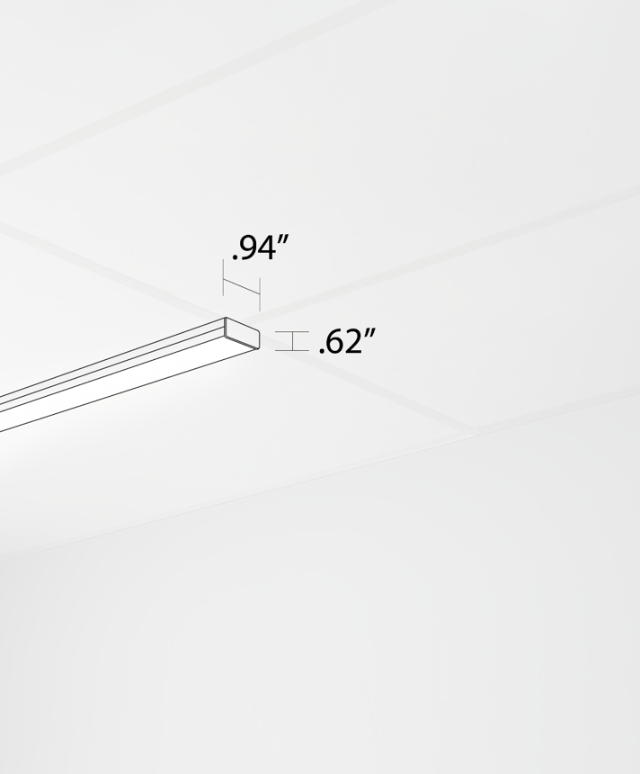 Alcon 14030-10-S, T-bar attaching surface linear ceiling light shown in silver and with a flush lens.