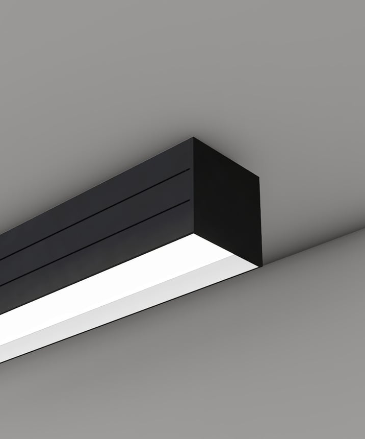 Alcon 12100-33-S-R, surface linear ceiling light shown in black finish and with a regressed lens.