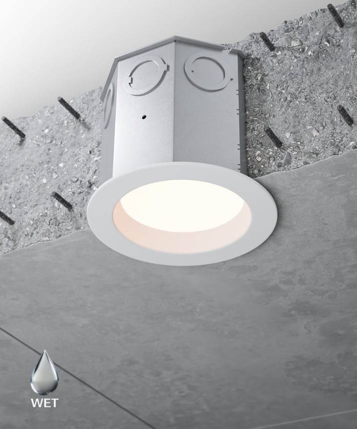 Alcon 14106-4ND Round High-Output Reflector Recessed Concrete Ceiling Downlight shown in a White finish,