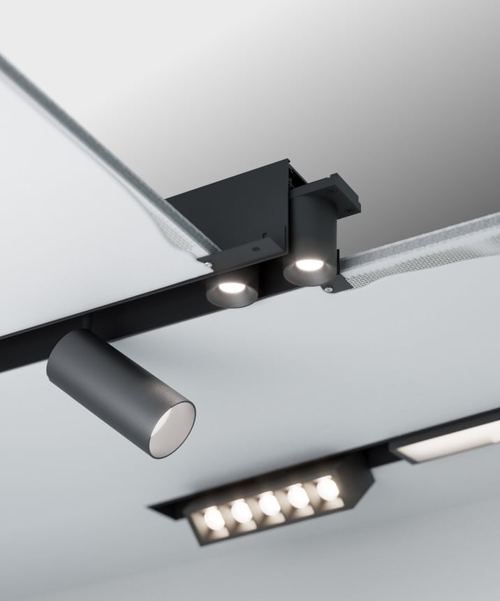 Alcon 15100 Modular Recessed System shown in Black on an adjustable length, 1.5" width and 2.6" height track with 14 accessories.