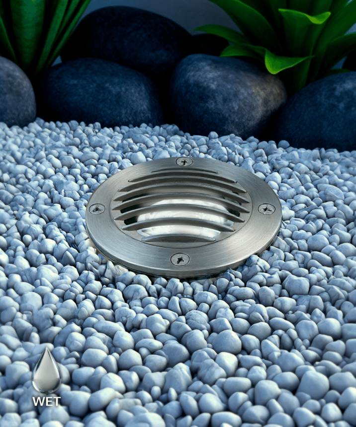 Alcon 9022 Low-Voltage 4-Inch In-Ground LED Well Light shown in a stainless steel finish.