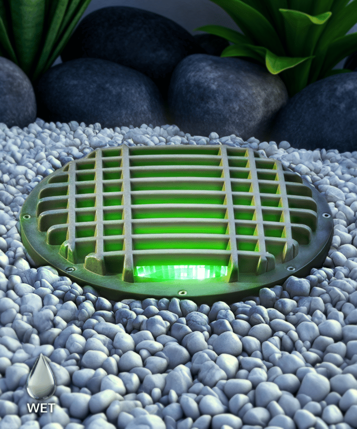 Alcon 9103RGBW LED Well Light shown in a bronze finish with green light.
