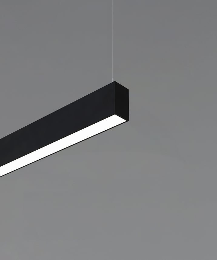 12100-12-P linear LED pendant light shown with black finish and 1-inch aperture diffuser lens