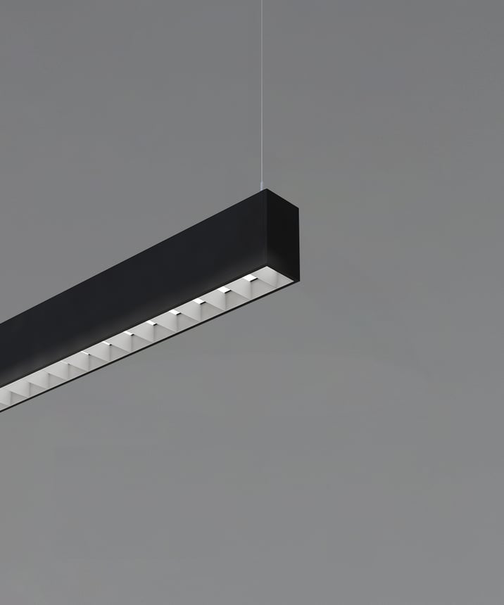 12100-12-P-L linear LED pendant light shown with black finish and 1-inch louver lens to reduce glare