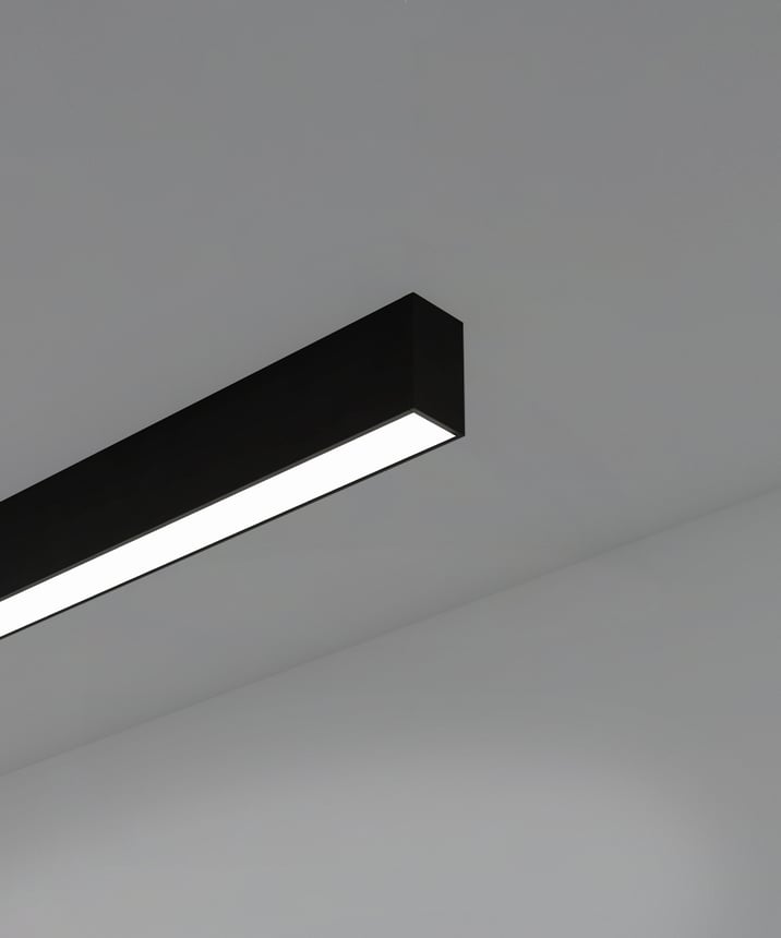 12100-12-S linear LED ceiling light shown with black finish and diffuser lens