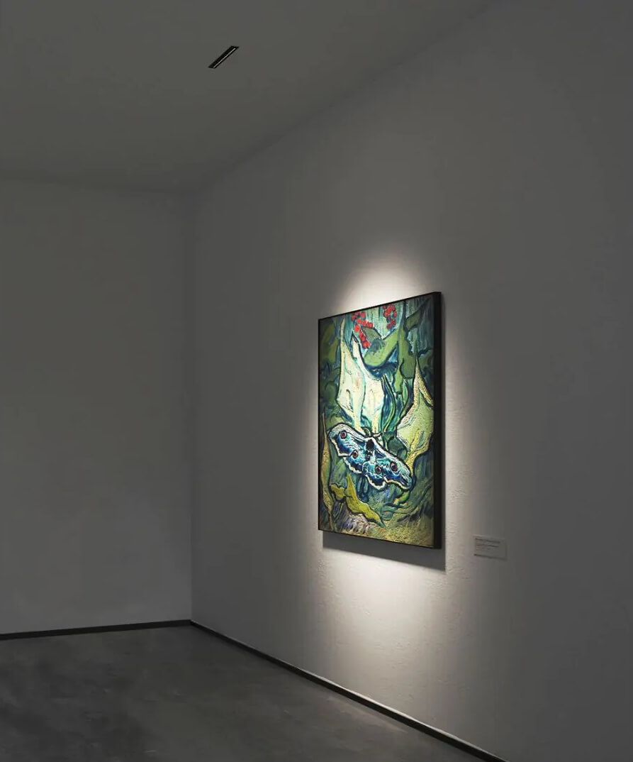 Micro LED multiple recessed lighting with superior color rendering capabilities illuminates an oil painting in an art gallery.