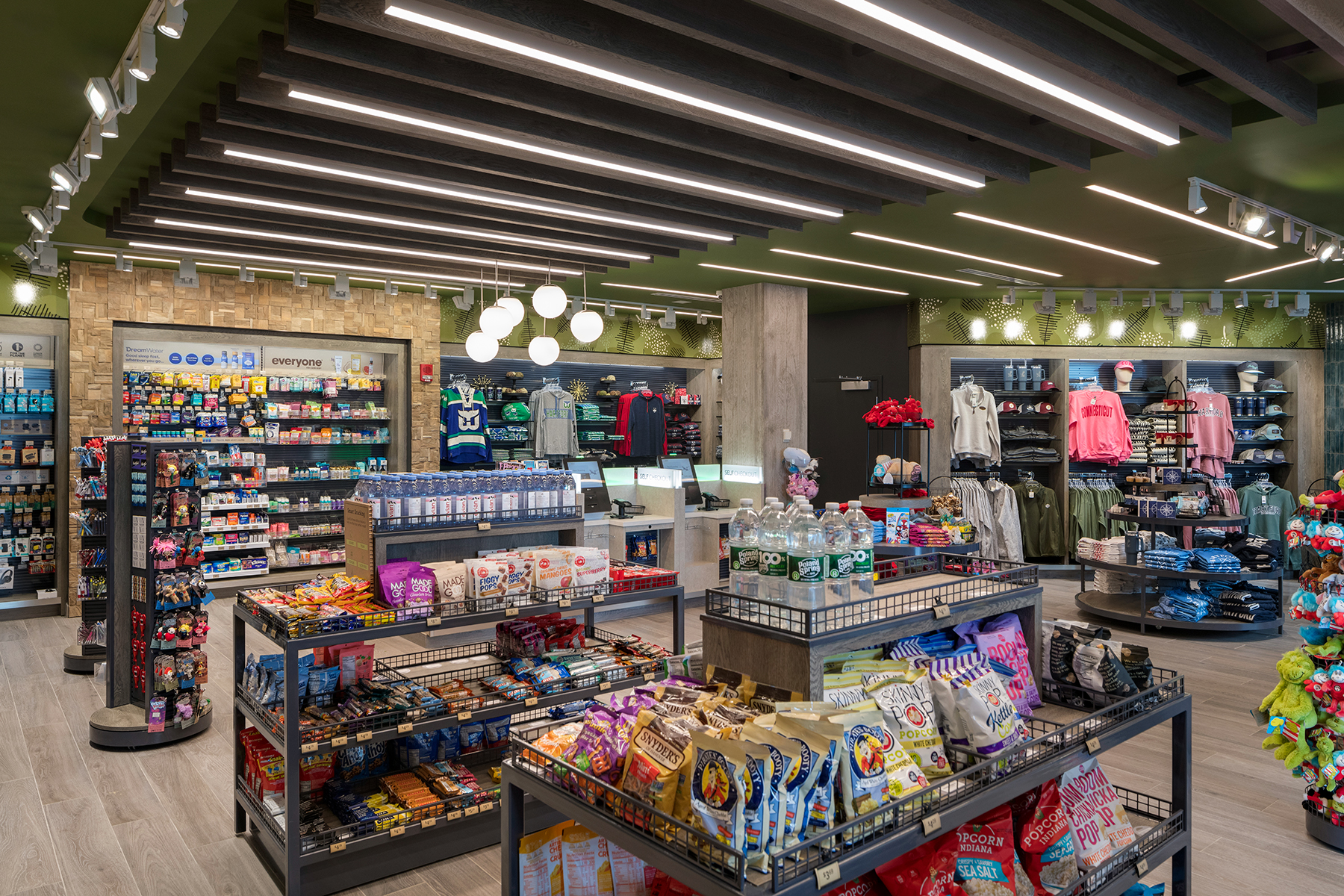 JGA created a unique design feature in Charter Oak Emporium with a slatted wood ceiling fit with linear suspension lights.