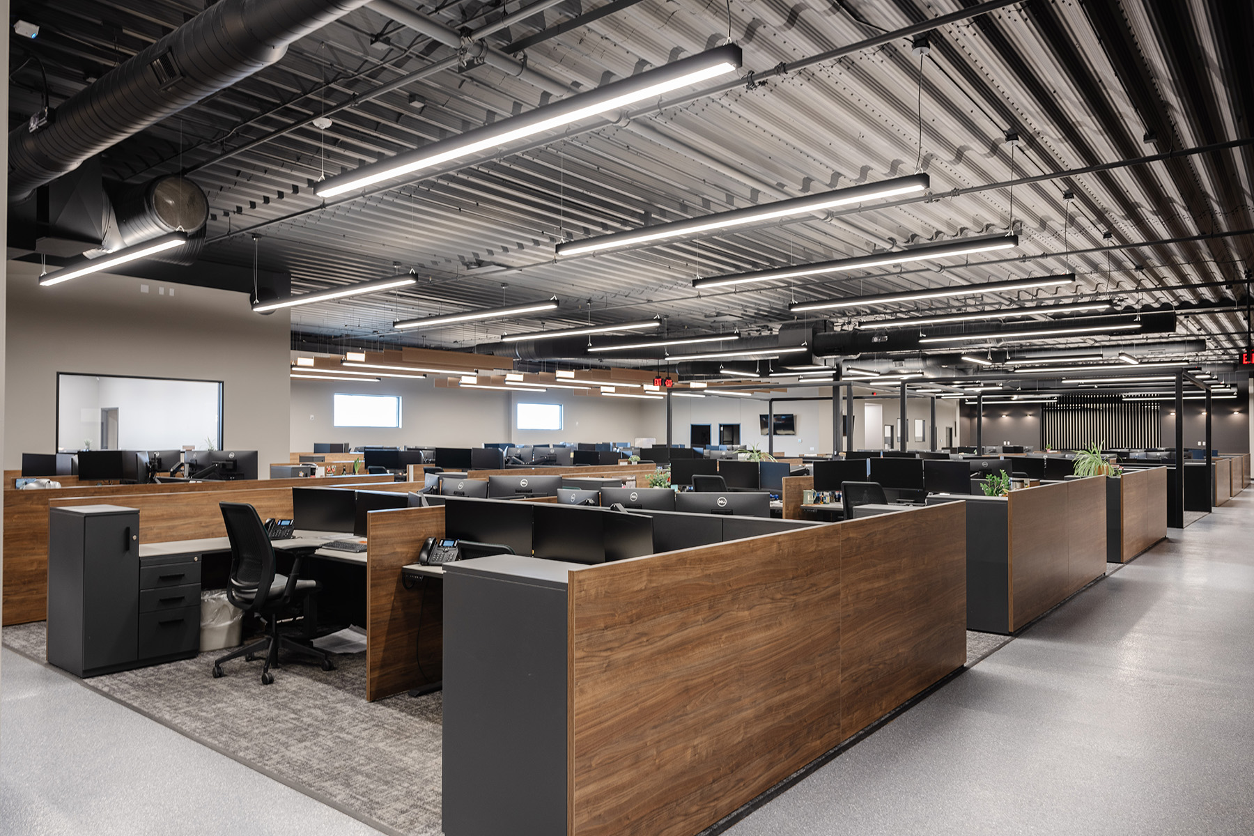 Linear LED pendant lighting provide uplighting and downlighting for a bright office environment with reduced glare on computer monitors.